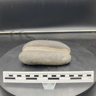 Stone tool (arrow shaft straightener?)
