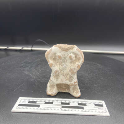 Headless white-painted votive figure