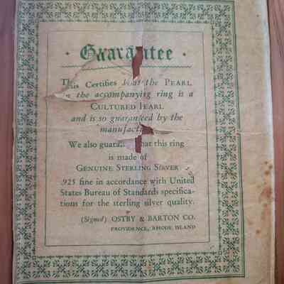 The image shows a vintage guarantee certificate for a cultured pearl ring, made of genuine sterling silver.
