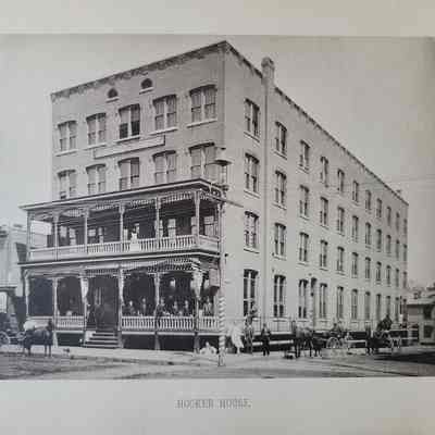 Photo caption reads: HOOKER HOUSE. Erected in 1884 by Samuel Hooker, it was once a prominent hotel, boasting 100 rooms and all the modern amenities a traveler could ask for, including steam heat and electric bells. The building was renamed the Seth Chauncy Hotel in 1938 and since then has had an unfortunate history of drugs and prostitution. It was set to be demolished in 2019.