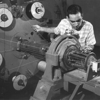Photograph of Industrial Worker Twisting Cable, William Brand Company