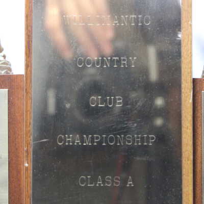 Closeup of front of trophy: Reads "Willimantic Country Club Championship Class A"