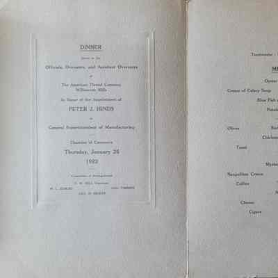 The both sides of the inside of the program, grey cardstock. On the left is printed in black the reason for the occasion, the date and names of those involved. On the right is printed in black the menu for the dinner.