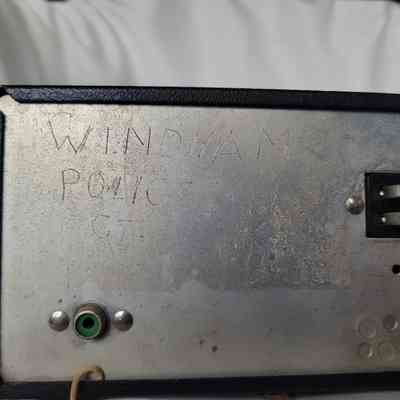 The image shows a metal box with "WINDHAM POLICE CT" etched on it