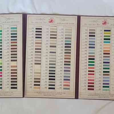 The image shows a color chart catalog featuring numerous thread swatches organized neatly by shade and color code.