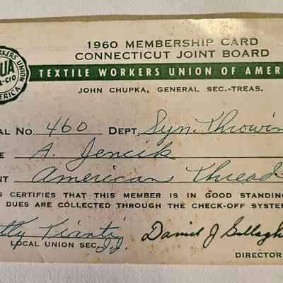 A. Jencik's 1960 Union Card, Signed by Local Secretary Betty Tianti: The image depicts a 1960 membership card from the Textile Workers Union of America, Connecticut Joint Board, belonging to a person named A. Jenick. The card features the union's logo, includes the local number 460 and department listed as "Syn. Throwing." The plant is identified as "American Thread," and the card certifies the member's good standing, with dues collected through the check-off system. The card is signed by Betty Tianti, Local Union Secretary, and David J. Gallagher, Director, displaying a slightly worn and aged appearance.