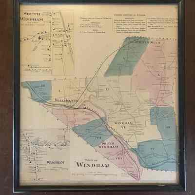 Map of Windham, includes South Windham in upper left corner.: A framed map of Windham, Connecticut. In the top left of the map is a small street map of South Windham. At the top right is a business directory listing physicians, hotels, and merchants. In the bottom left is a street map of Windham. The rest of the space is taken up by the main map of Windham including North Windham, Willimantic, Windham, and South Windham. The map is color coded with eleven different numbered sections.