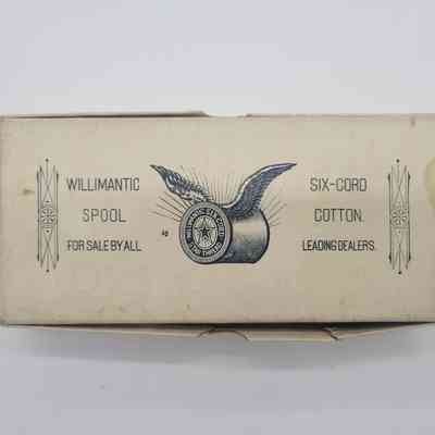 The image shows a vintage box for Willimantic spool cotton, featuring winged spool graphics.