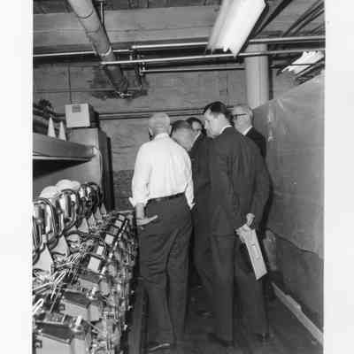 Textile Mill Executives Inspecting Machinery