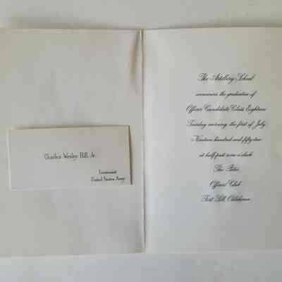 The open card, on a white background. On the left is a place card, white with black printing, on the right is black printed script text.