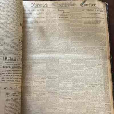 An inside picture showing a Norwich Courier publication.: This is the cover page from The Norwich Courier. There are 7 columns of news with multiple articles per column.