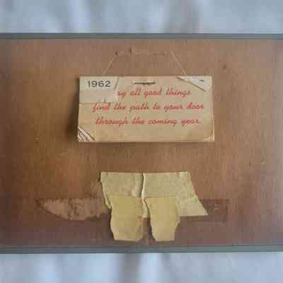 The framed message from 1962 wishes all good things to find the path to your door.