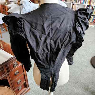 Back, showing the tails.