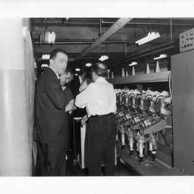 Textile Mill Executives Inspecting Machinery