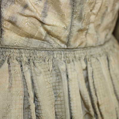 Catridge pleating at waist, back of dress