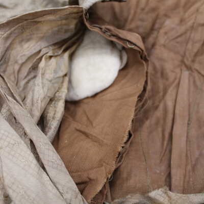 Batting visible within bust