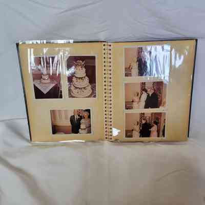 An open photo album displays several pictures