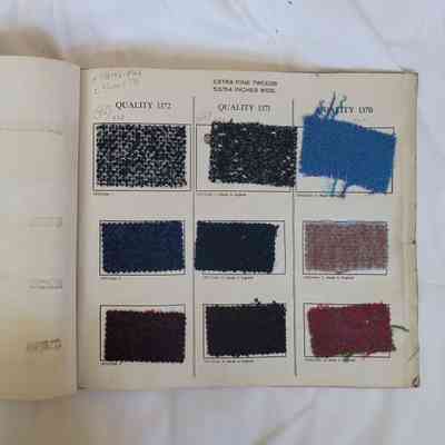 The image shows an open book displaying fabric samples, labeled as "Extra Fine Tweeds."