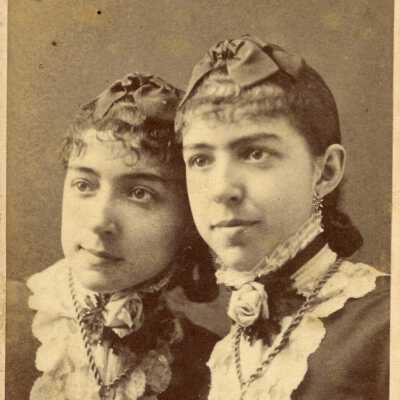 Nelle & Belle Dodge: According to the back of the picture, Nelle is the one with her mouth to the side.