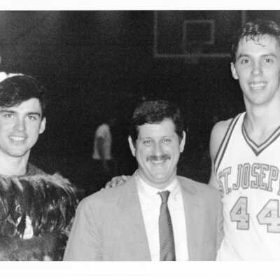Men's Basketball player Bob Lojewski with Hawk mascot and Athletic Director, Mike Shultz