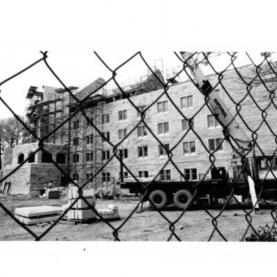 Side view of McShain near end of construction with flatbed truck.