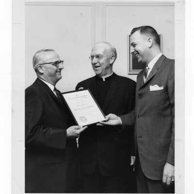 Shaffrey award recipient, Dr. William A. Sodeman, showing certificate to J. Joseph Bluett, S.J., and Dr. Michael Devine, April 29, 1962.