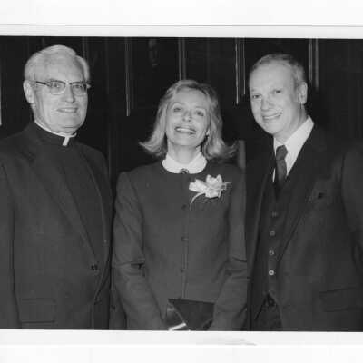 Michael J. Smith, S.J., with two unidentified individuals.