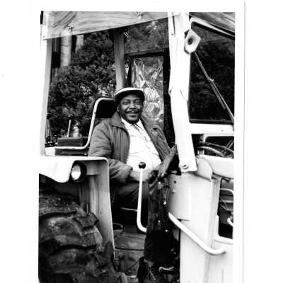 Groundbreaking for Sports Complex (addition to Field House) with driver seated on bulldozer.