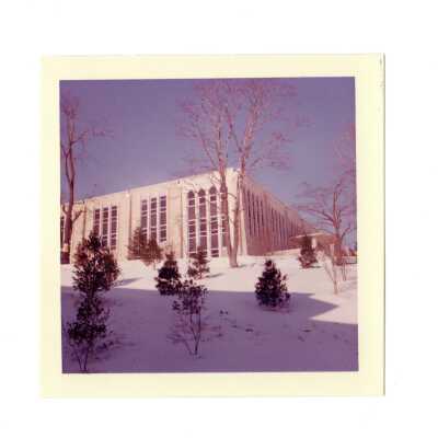 Exterior side view of Drexel Library in the snow.