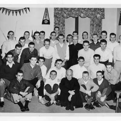 Students residents of Quirk Hall with Francis J. Emory, S.J.