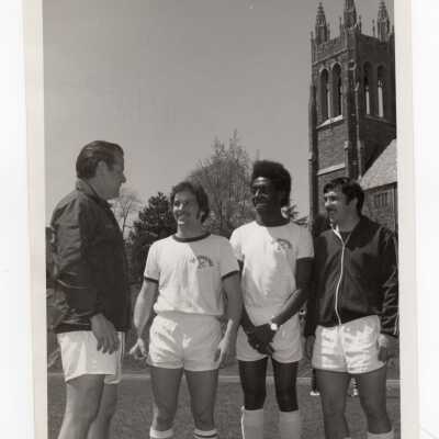 Men's soccer team members Ralph Cirino, Steve Morgan with Coaches Jack Dunn and Jack Ruggeri, 1974.