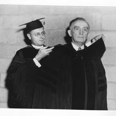 Edward G. Jacklin, S.J., with honorary degree recipient, Senator Joseph C. O'Mahoney at 1951 graduation/commencement.