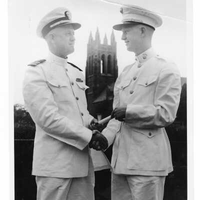 Graduating student, Gordon Shockley,with his father, Lt. Commander Lawrence Shockley after being commissioned in Marine Corps during 1955 graduation/commencement.