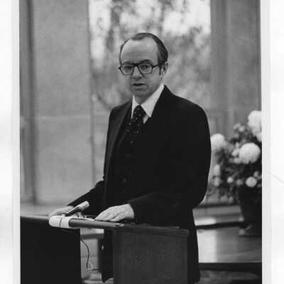 Thomas P. Melady standing at podium in Drexel Library.
