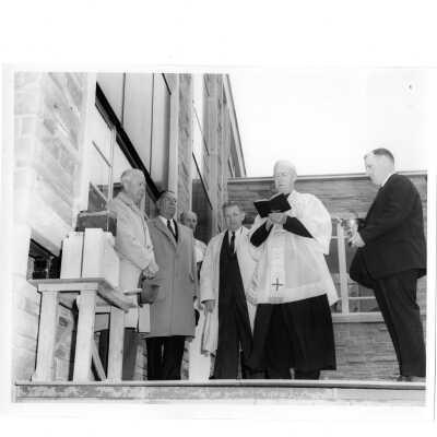 Blessing of Campion cornerstone with J. Joseph Bluett, S.J., Albert Dagit (architect), and Brother Boyle.