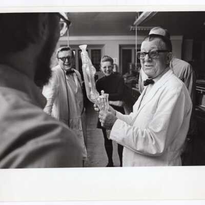 Students and professor in glass blowing course offered by Chemistry Department, c. 1965.