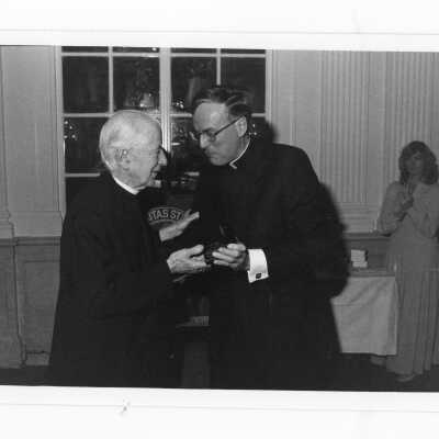 Donald I. MacLean, S.J., with Bertholomew Sheehan, S.J. at alumni awards dinner, c. 1980.