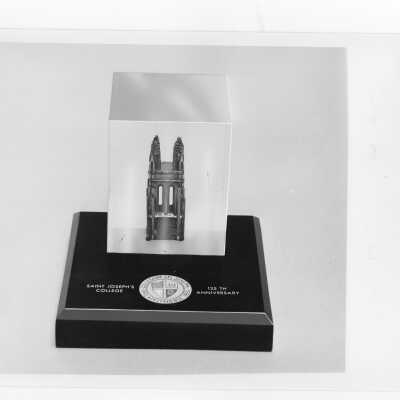 Paper weight commemorating the 125th anniversary of Saint Joseph's College.