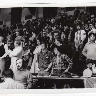 Spectators at basketball game, including Donald I. MacLean, S.J.at Palestra?