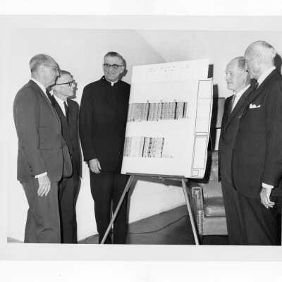 William F. Maloney, S.J. and others discussing plans for new science center.