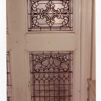 Interior view of leaded windows in stairway of Wolfington Center (formerly Gest Estate, Neumann Hall).