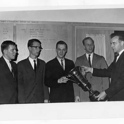 Students from Villiger Debating Society, receiving TV Guide trophy from James R. Kelley of TV Guide and Mother Mary Dennis, moderator of the Rosemont College Debating Club at the annual Rosemont College Debating Tournament.