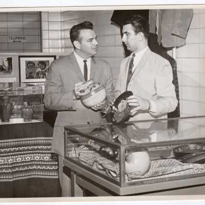 Anthony M. Swartz and Joseph Tozzi attending arts and crafts exhibit at Saint Joseph's College as part of month-long Pan American Observance, April 1965.
