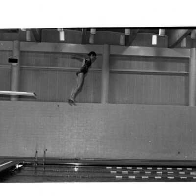 Woman diving into swimming pool in Sports Complex.