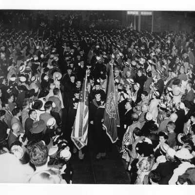 View of procession in Field House at end of 1952 graduation/commencement ceremony.