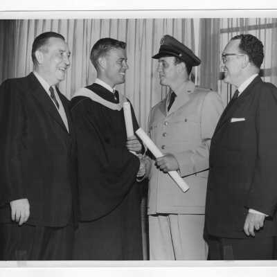 Graduating student, Francis John Myers (class 1955), with his father, former state senator Francis Myers, and William Berry of the Keystone Auto Club, with his son, William Edward Berry (class 1955).