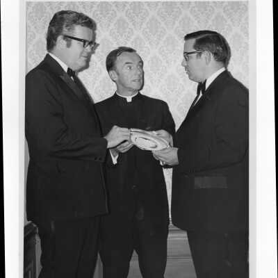 Terrence Toland, S.J., and another individual congratulating Camden mayor Joseph M. Nardi, Jr. for receiving Law Alumni Award, Nunc Pro Tunc Award, November 16, 1971.