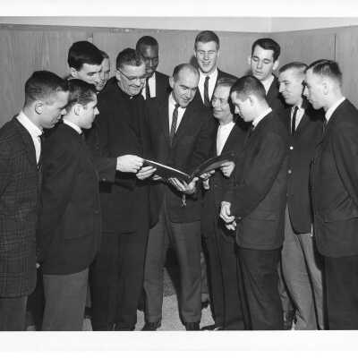 Men's Basketball Coach Jack Ramsay, Pres. Maloney, and Players