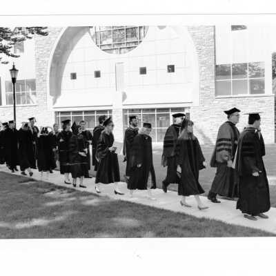 Faculty members processing in front of chapel during 1993 graduation/commencement.