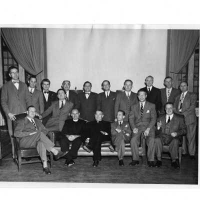 Alumni reunion of class of 1928 held on October 28, 1948. John J. Long, S.J., in pictured in center of group.